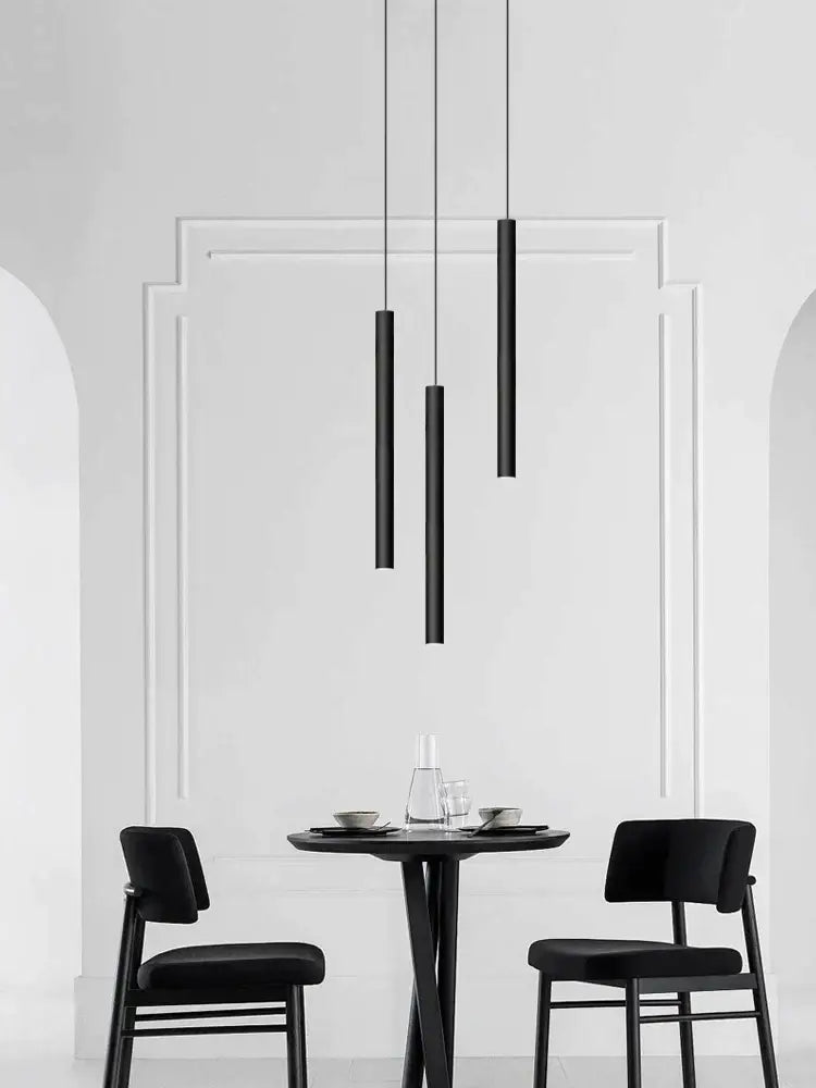 Modern black cylindrical led staircase chandelier suspension light features sleek matte decorbites cylindrical led pendants