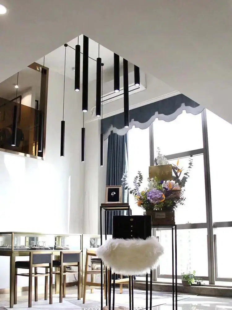 Modern black cylindrical led staircase chandelier suspension light featuring decorbites cylindrical led pendant lights