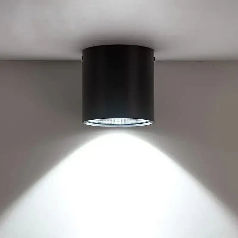 Modern black cylindrical pendant ceiling spot light with sleek design ideal for kitchen lighting applications