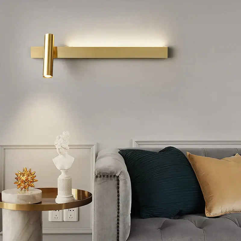 Gold-toned minimalist copper wall light with sleek rectangular bar and cylindrical fixture for bedroom decorbites reading lamp