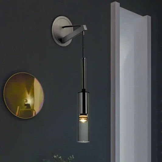 Modern black cylindrical wall sconce with frosted glass shade and brushed metal mounting bracket for elegant crystal decorbites elegant crystal wall lighting