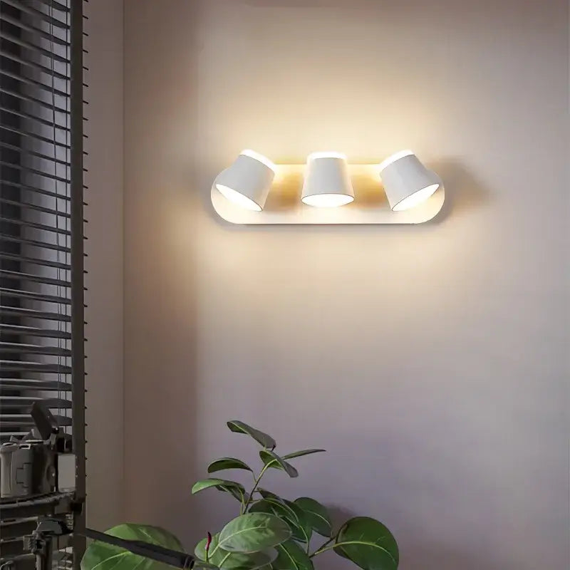 White three-light wall lamp with cylindrical shades and sleek modern design for decorbites adjustable led wall use