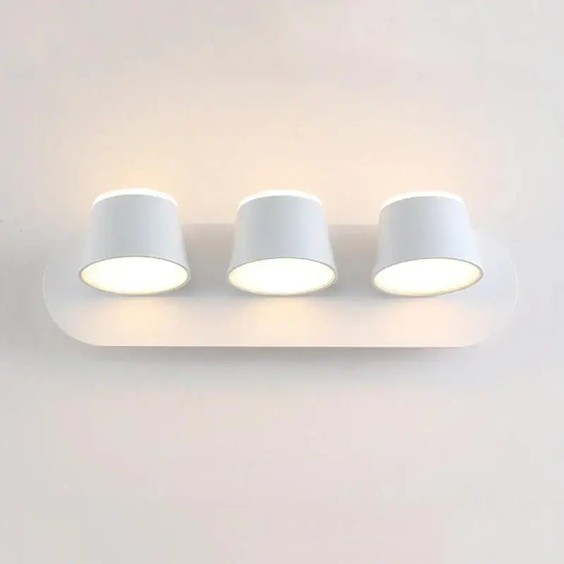 White minimalist wall lamp with three cylindrical lamps featuring decorbites adjustable led for bedroom sconce use