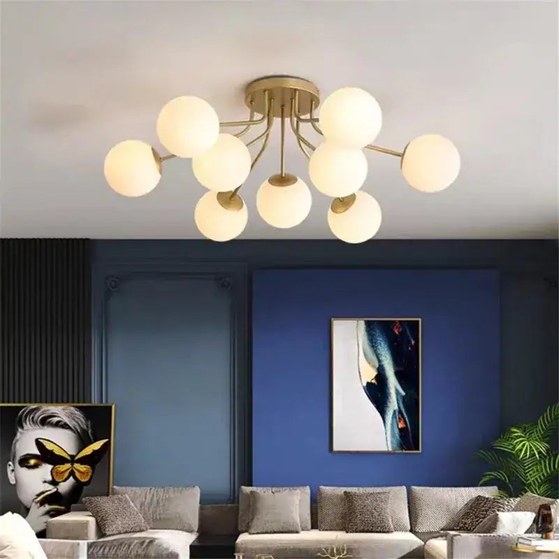 Modern black decorbites bubble glass led ceiling light with gold-toned frame and frosted glass globe bulbs for living room