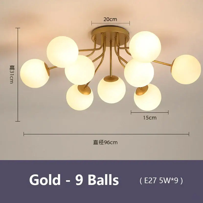 Modern black decorbites bubble glass led ceiling light with nine frosted glass spheres in a gold-toned branching design