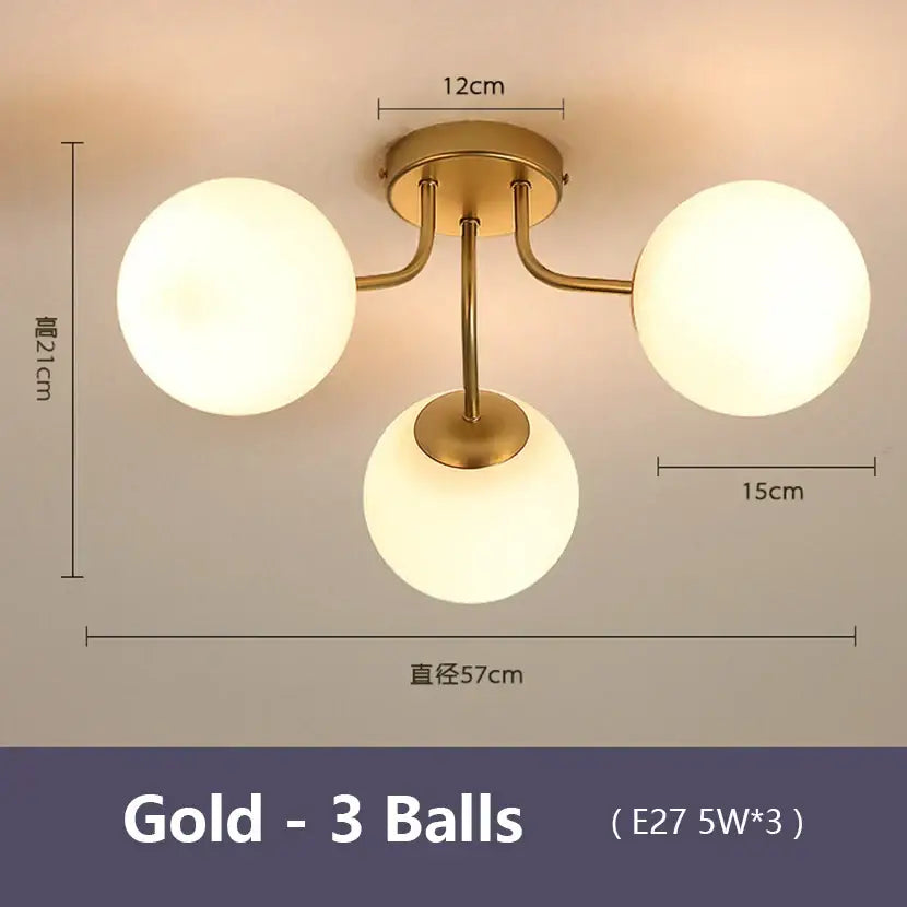Modern black decorbites bubble glass led ceiling light with gold-colored fixture and three frosted globe bulbs for living room