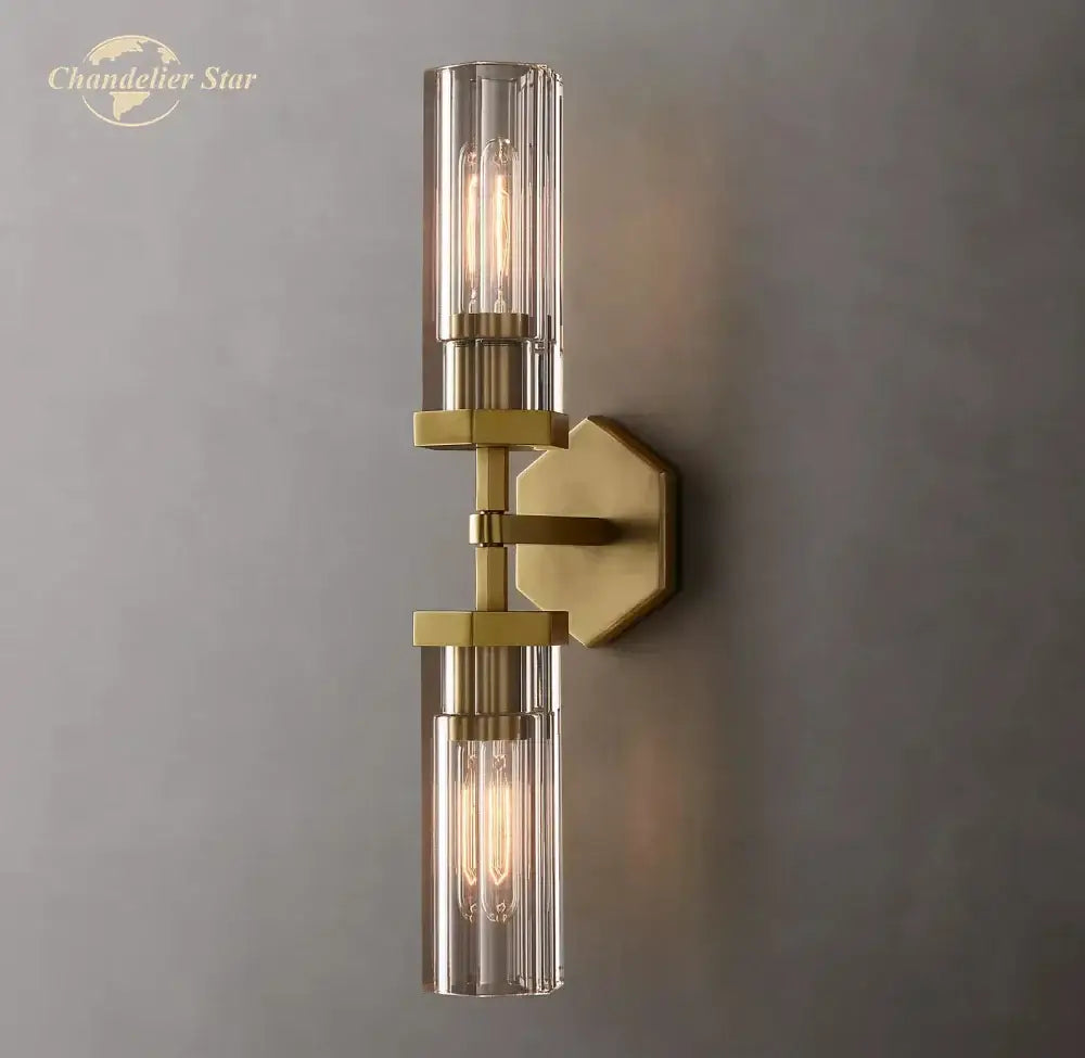 Modern black decorbites crystal hexagonal sconce featuring brass-finished wall sconce with glass cylinders and filament bulbs