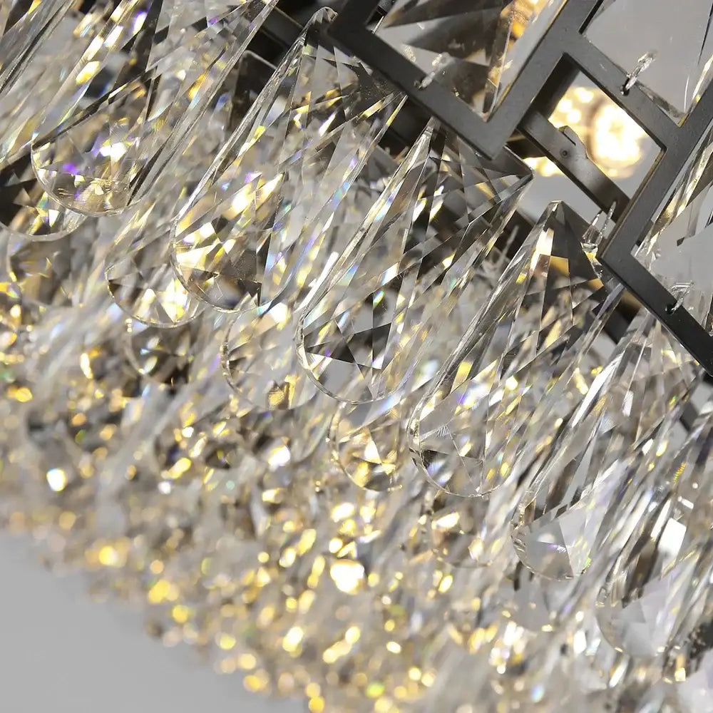 Modern black decorbites crystal led chandelier with black metal frame and cascading clear crystal teardrop pendants for dining room light