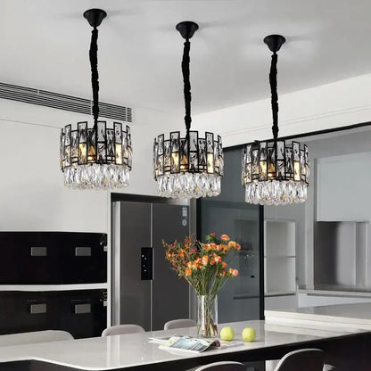 Three black-framed decorbites crystal led chandeliers with hanging clear glass crystals for dining room lighting