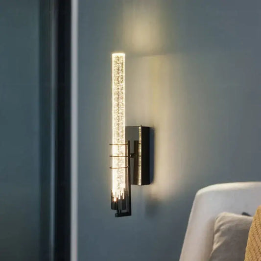 Modern black decorbites crystal wall light with sleek metal base and vertical crystal glass tube for bedroom sconce lighting