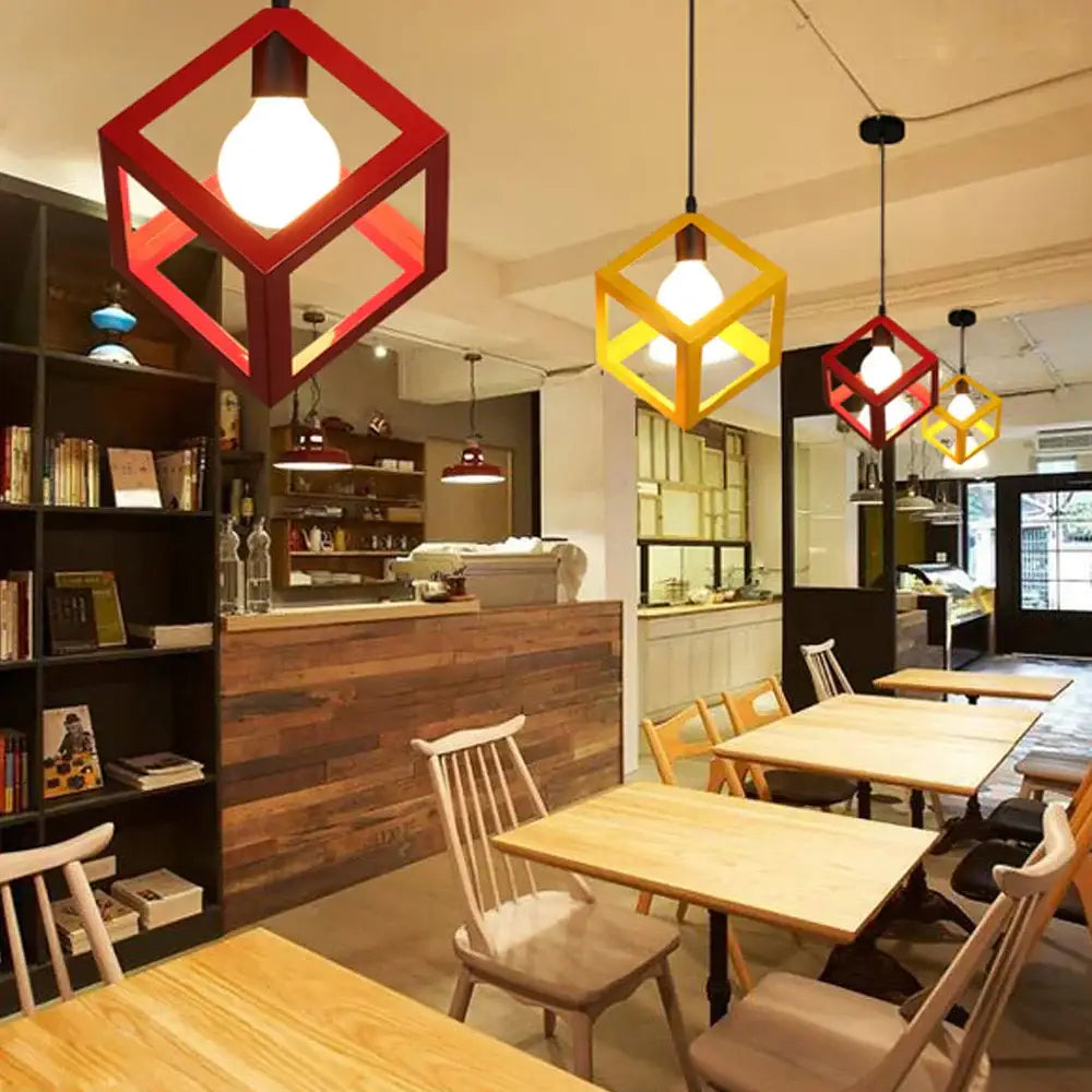Modern black decorbites geometric led pendant lights in red and yellow with exposed bulbs for kitchen lighting