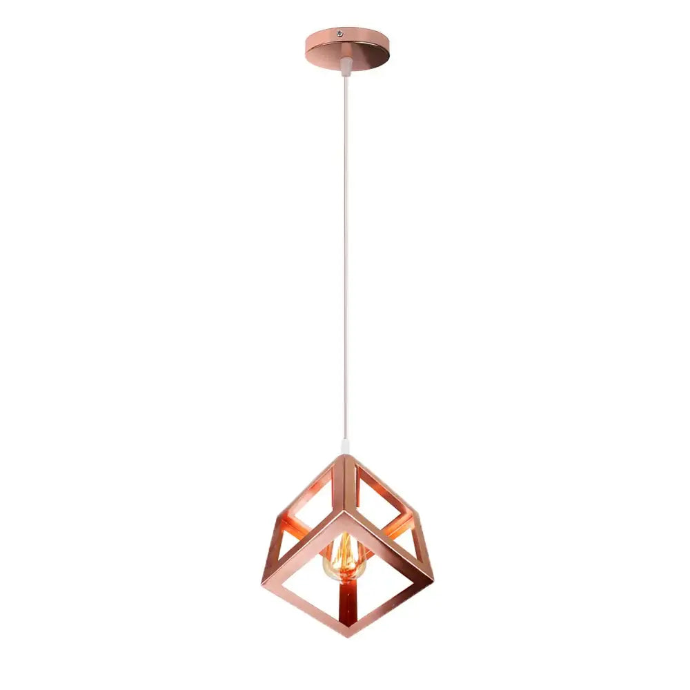 A modern rose gold decorbites geometric led cube pendant light with exposed bulb for kitchen lighting