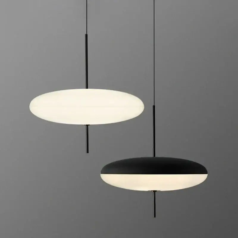 Minimalist modern black designer iron pendant light with sleek rods and oval shades for dining room and bar decorbites designer iron pendant