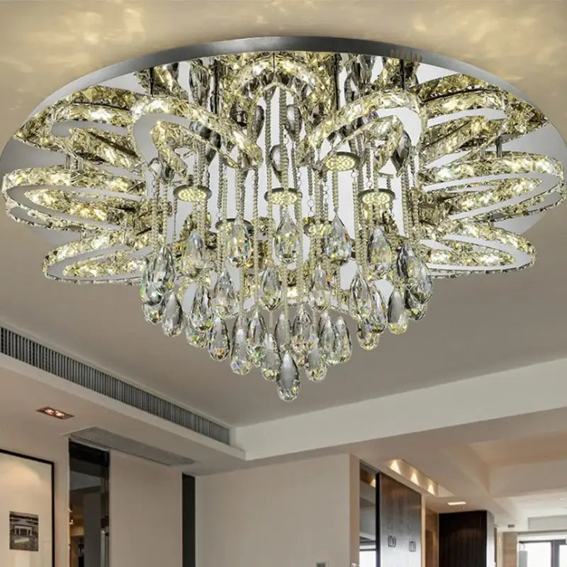 Modern black dimmable led crystal chandelier with clear crystal teardrop pendants and swirling metallic rings for dining room decorbites dimmable led