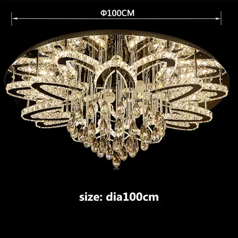 A luxurious gold-toned modern black dimmable led crystal chandelier with layered circles and teardrop crystals for dining room decorbites dimmable led