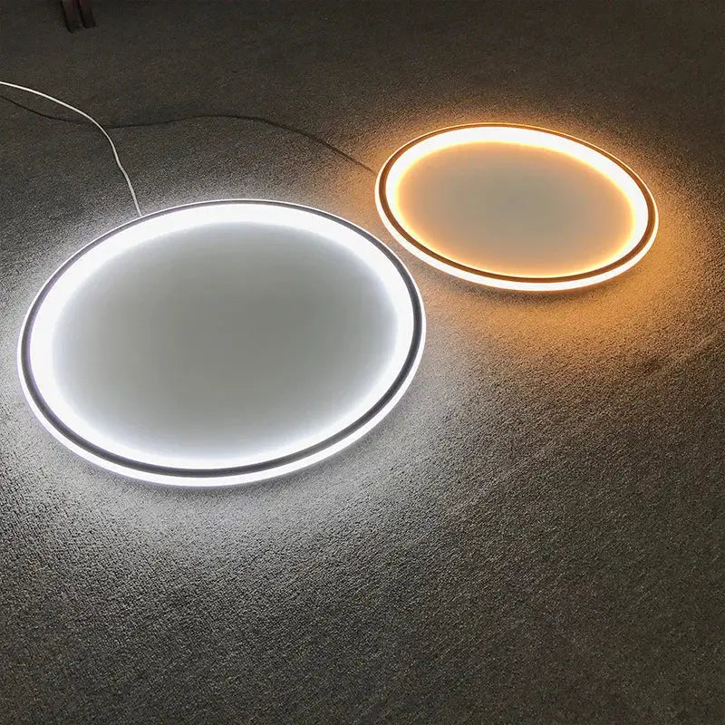 Modern black dimmable led ring ceiling lights with thin metallic frames emitting bright white and warm yellow glows