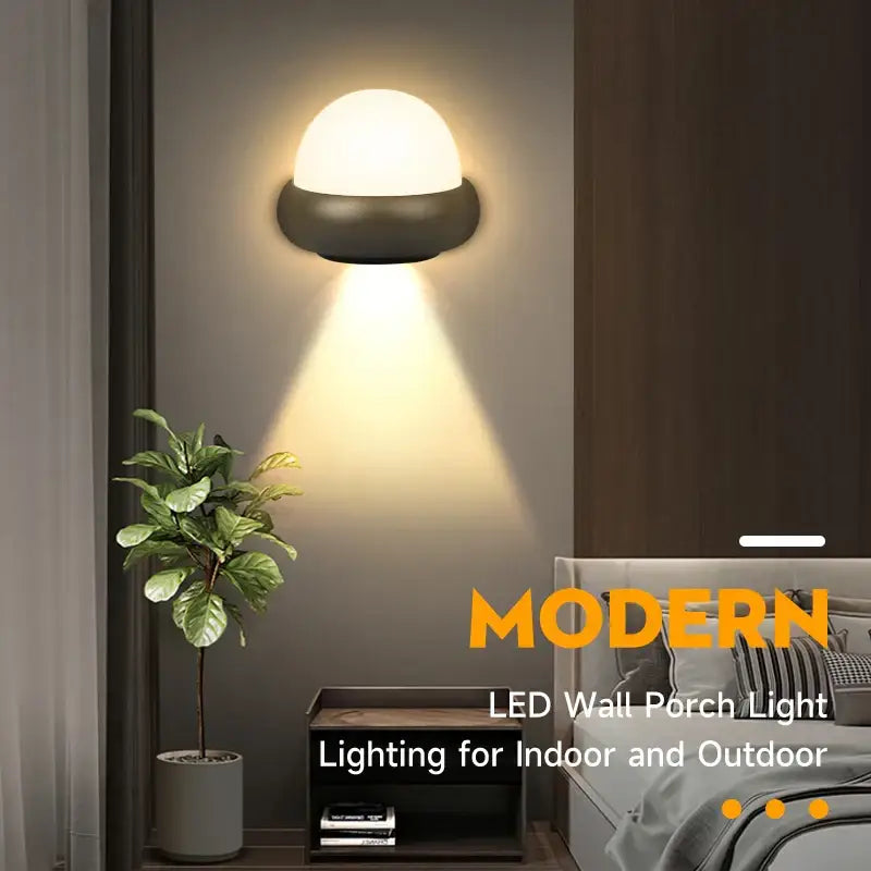 Modern black dome led wall light with sleek dome-shaped design providing warm outdoor lighting