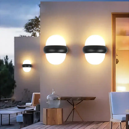 Modern black and white led wall light with frosted glass shades designed for outdoor warm lighting use
