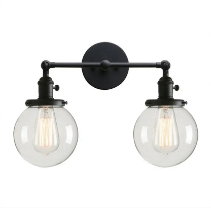 Black wrought iron modern double ball heads globe glass wall sconce with two clear globe shades for bedroom lighting