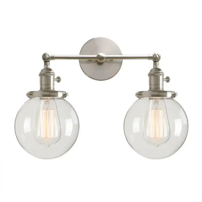 Brushed nickel double ball heads globe glass wall sconce with clear spherical shades and exposed filament bulbs for bedroom lighting