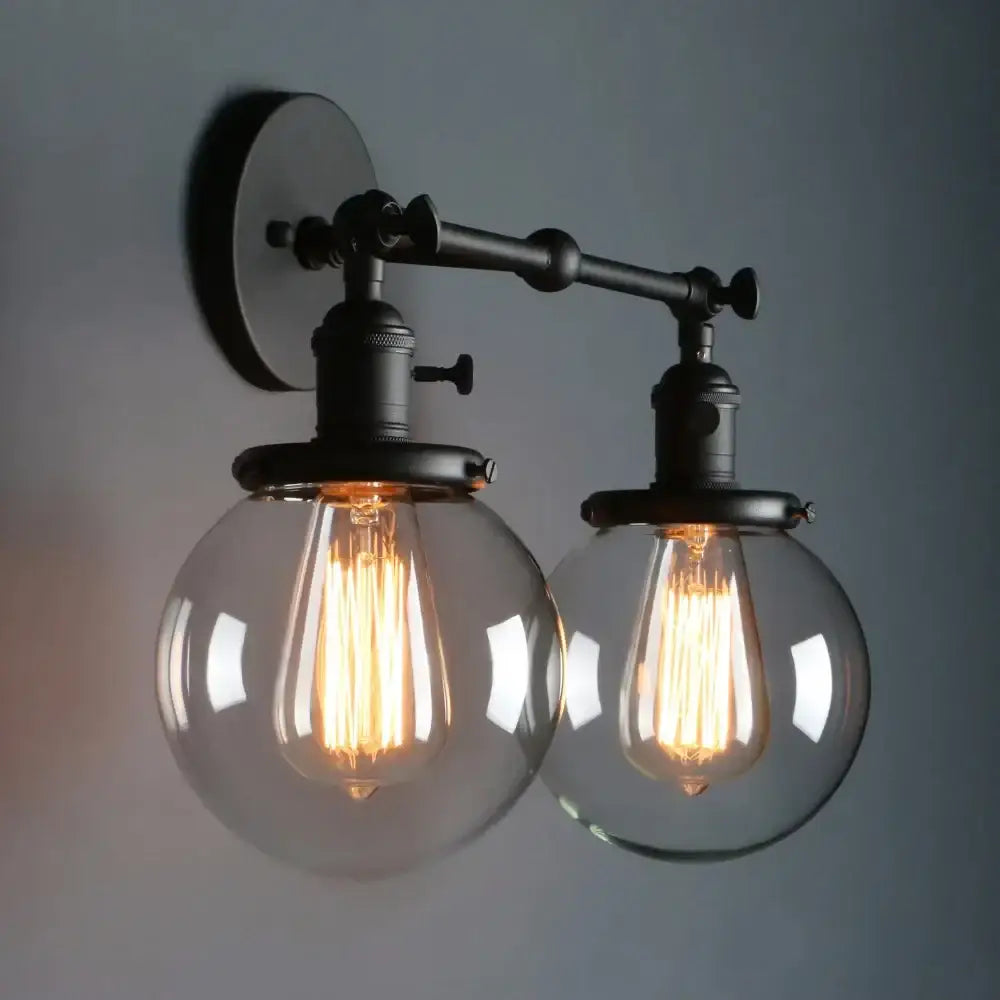 Modern black double ball heads globe glass wall sconce with two clear globes and warm filament bulbs for bedroom lighting