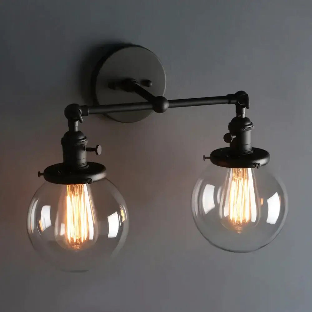 Modern black double ball heads globe glass wall sconce with two spherical shades and exposed filament bulbs for bedroom light