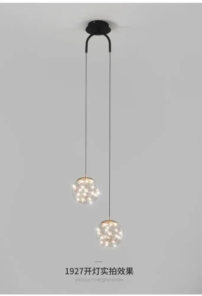 Modern black double glass ball pendant light with two warm glowing spherical glass ball pendant lights for bedroom ceiling
