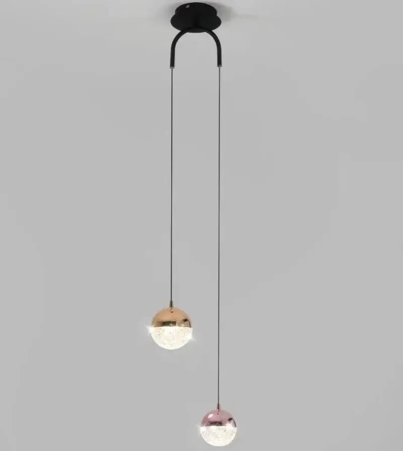 Modern black double glass ball pendant light with rose gold and copper finishes for bedroom ceiling lighting