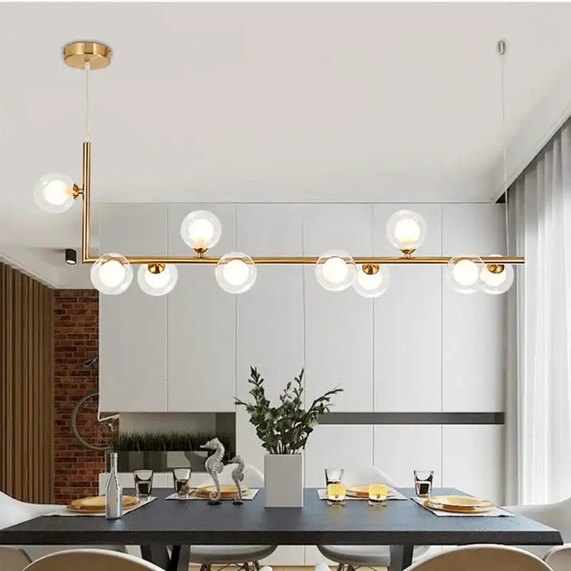 Modern black double glass lampshade chandelier with gold-toned pendant and clear glass globes for dining room lighting