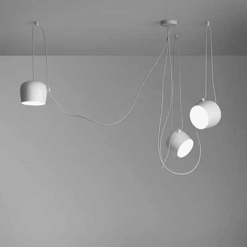 Modern white pendant lights with sleek minimalist design and flexible cords complement decorbites black drum led kitchen ceiling light