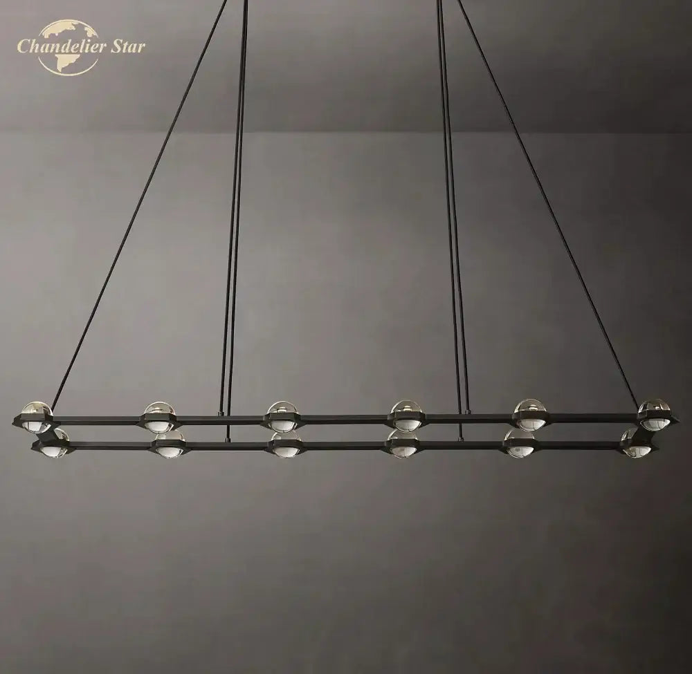 Modern black éclatant crystal chandelier with spherical glass globe lights suspended by thin cords for dining room use