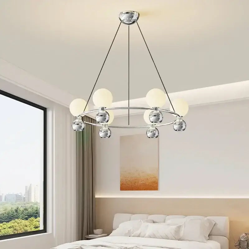 Modern black nordic pendant chandelier with chrome frame and eight frosted glass globe lights in circular pattern