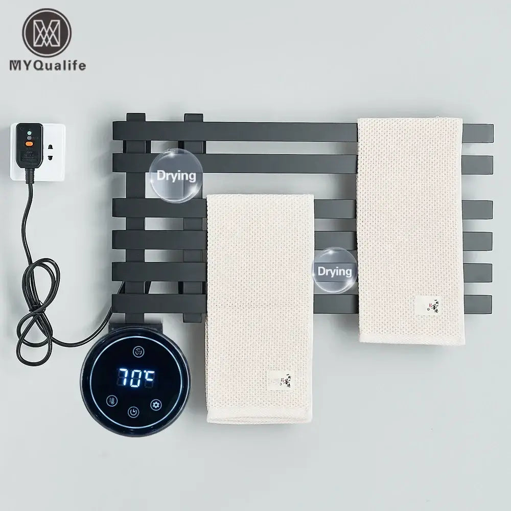 Modern black electric towel warmer rack with digital temperature display and two beige textured towels hanging on it