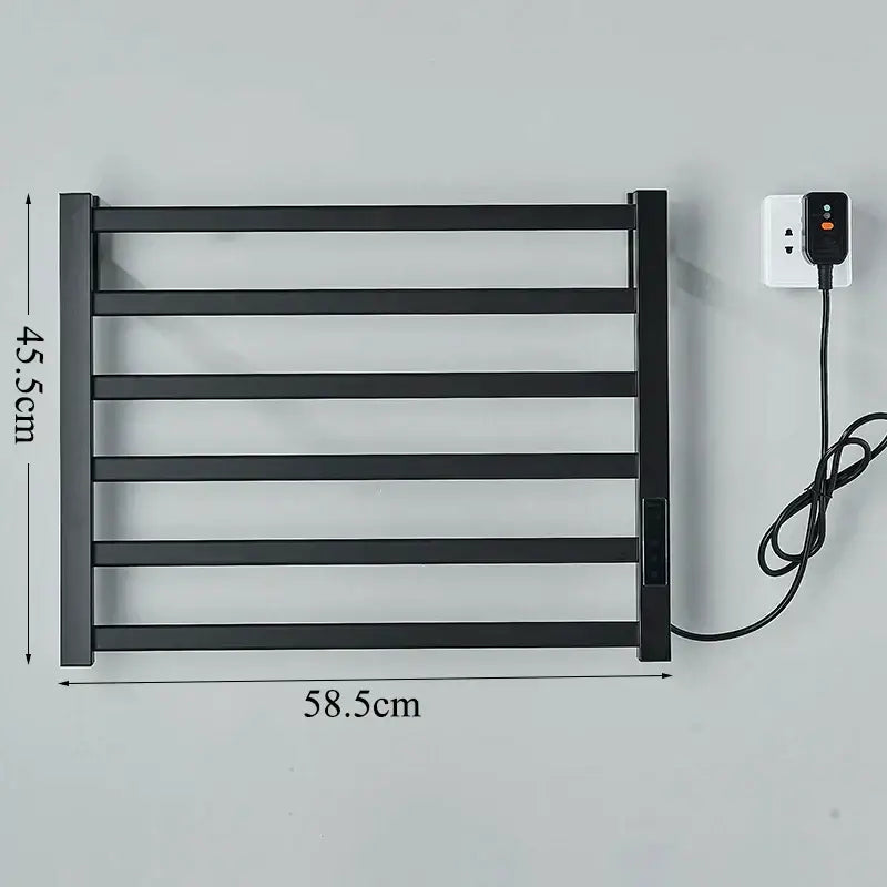 Modern black electric towel warmer with five horizontal bars and digital display plugged into bathroom outlet