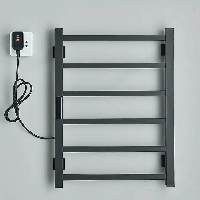 Modern black electric towel warmer with five bars and digital display plugged in for bathroom use as towel warmer