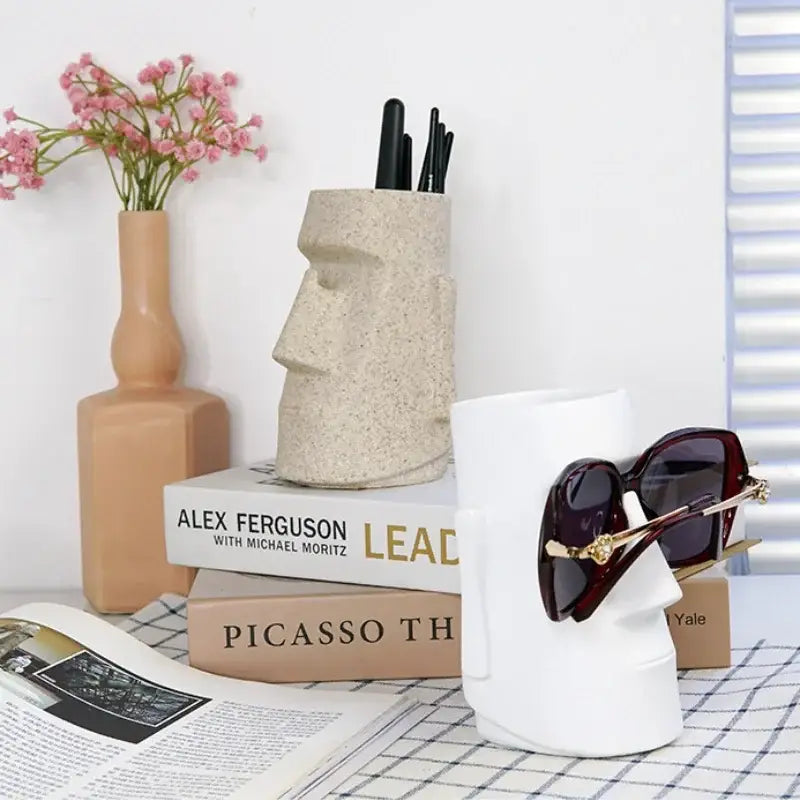 Beige textured stone moai head pen holder resin desktop organizer from decorbites for modern bedroom use