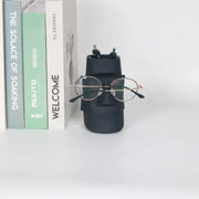 Modern black face desktop organizer in matte ceramic resin by decorbites holding glasses and pens for office use
