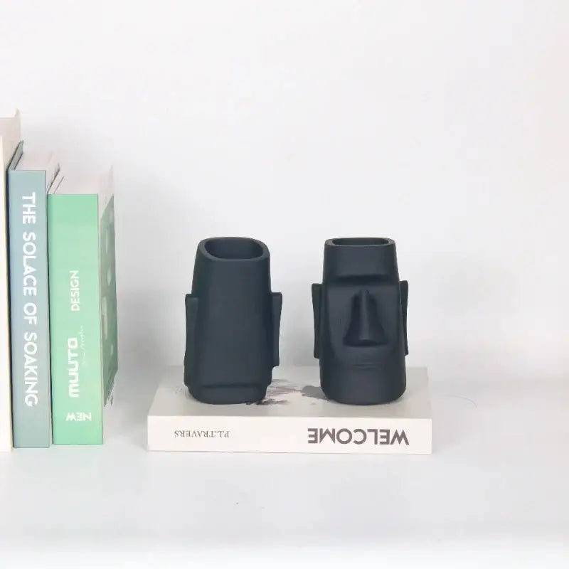 Modern black face desktop organizer set of two matte black ceramic moai statues by decorbites for desktop decor