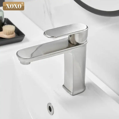 Modern black finish brass basin faucet with stainless steel single-handle and sleek polished chrome design by decorbites