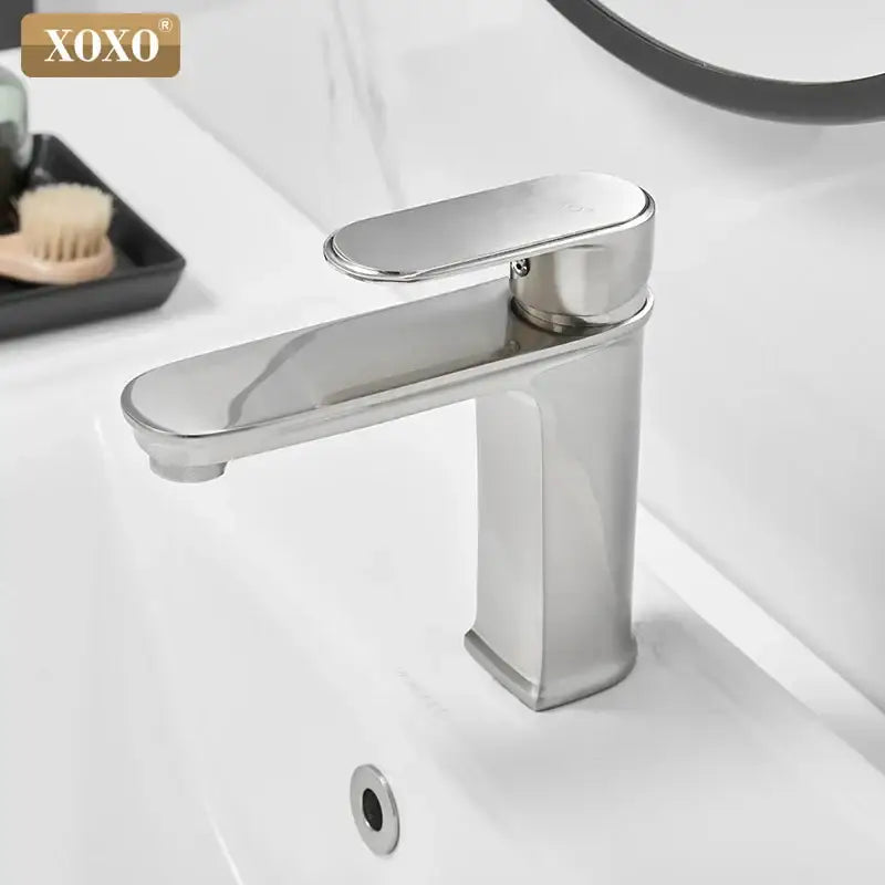Modern black finish brass basin faucet with stainless steel single-handle and sleek polished chrome design by decorbites
