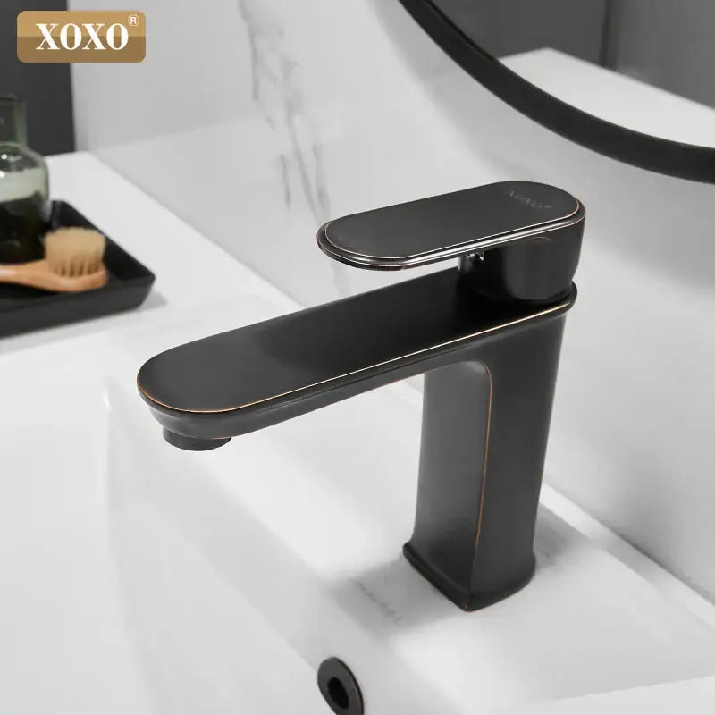 Xoxo modern basin faucet in black finish brass with brushed bronze accents for bathroom hot cold water mixer decorbites black finish