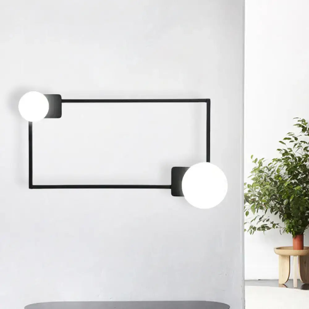 Modern black finish rectangular wall sconce with two white glass globe bulbs for bedroom lighting