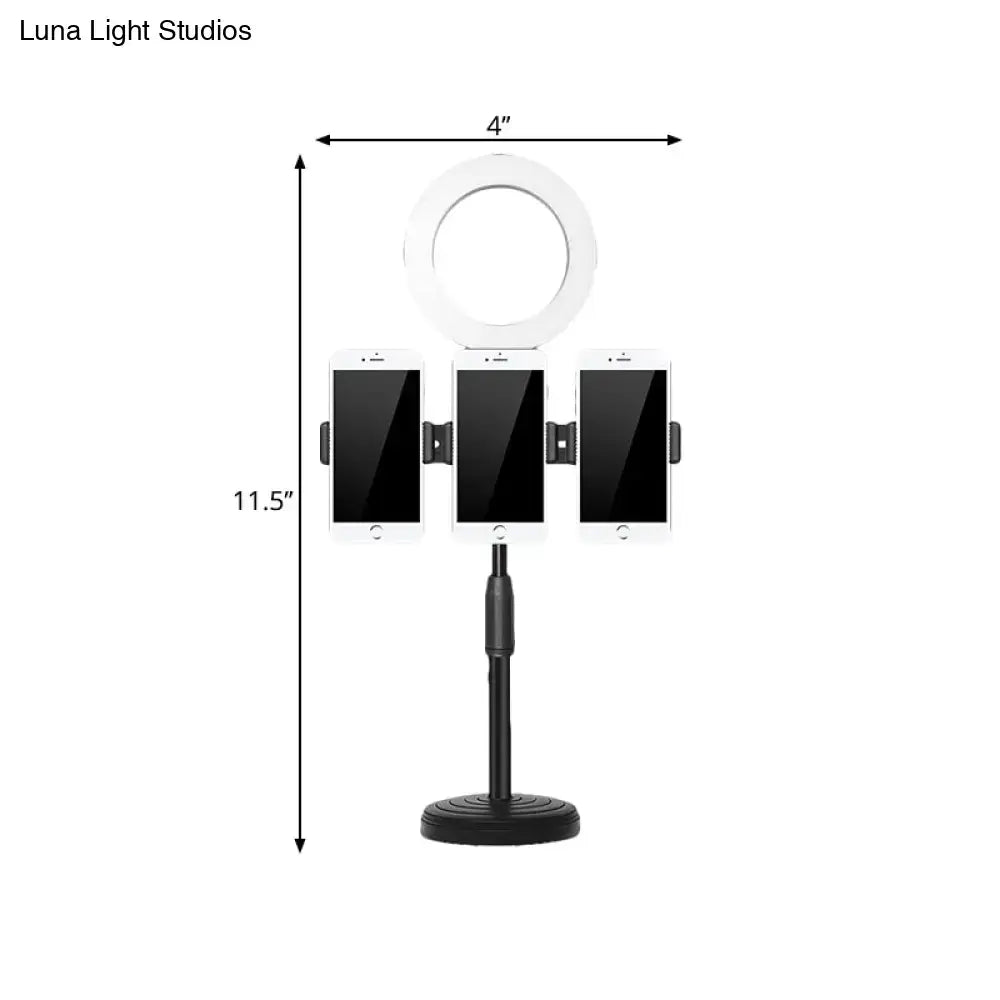 Modern black finish vanity light ring with metal shade and three phone holders on adjustable bedroom stand