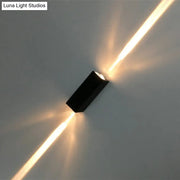 Modern black finish wall lamp dual beam sconce emitting two warm golden light beams for hotel and indoor use