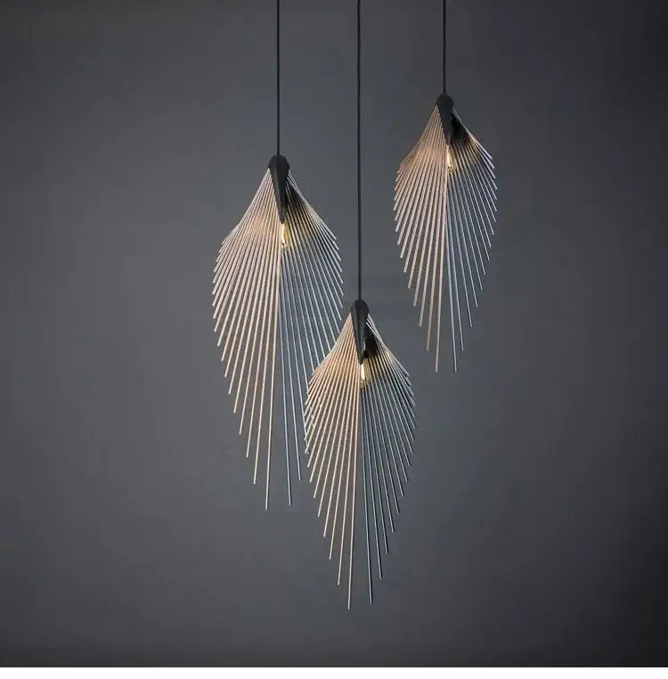 Modern black flying wing shape metallic pendant lights with sleek feather design and warm glowing bulbs for living room