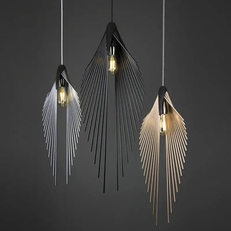 Three modern pendant lights with flying wing shape metal structures in black silver and gold for living room use