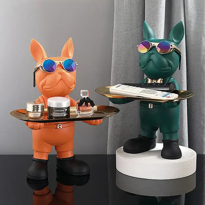 Two stylized decorbites french bulldog sculptures in orange and teal holding trays for living room decor
