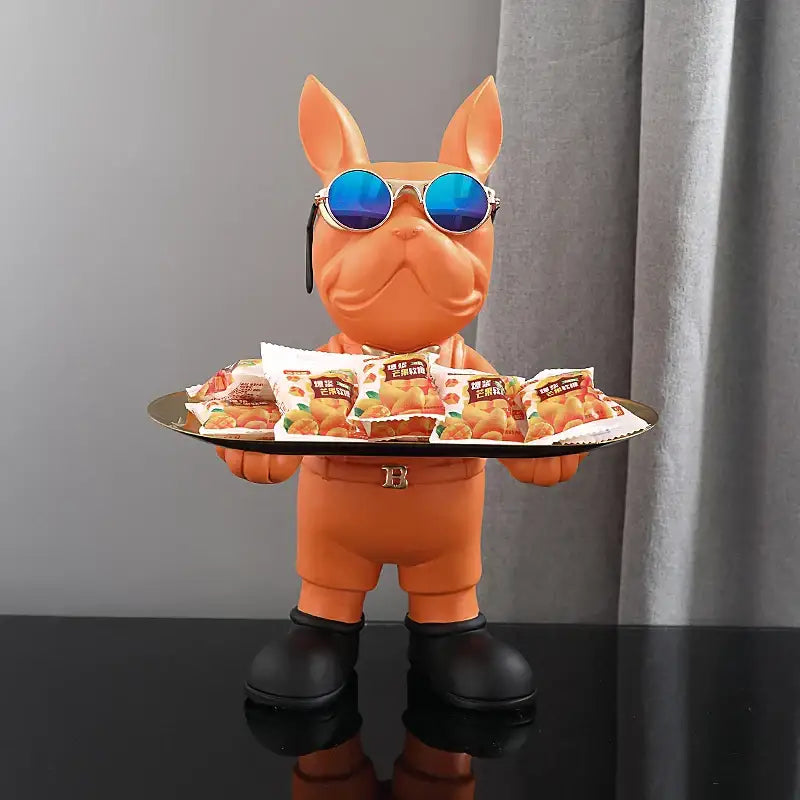 Modern black french bulldog sculpture key tray featuring an orange decorbites french bulldog figurine with blue sunglasses holding snacks