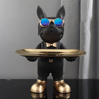 Modern black french bulldog sculpture by decorbites wearing blue sunglasses and gold accessories holding a key tray