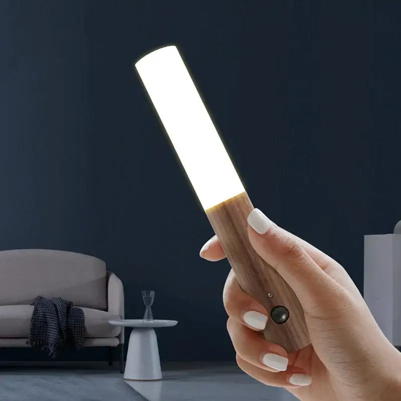 A modern black frosted glass night light corridor wall sconce with bodysense led rechargeable bright white light bar and wood handle
